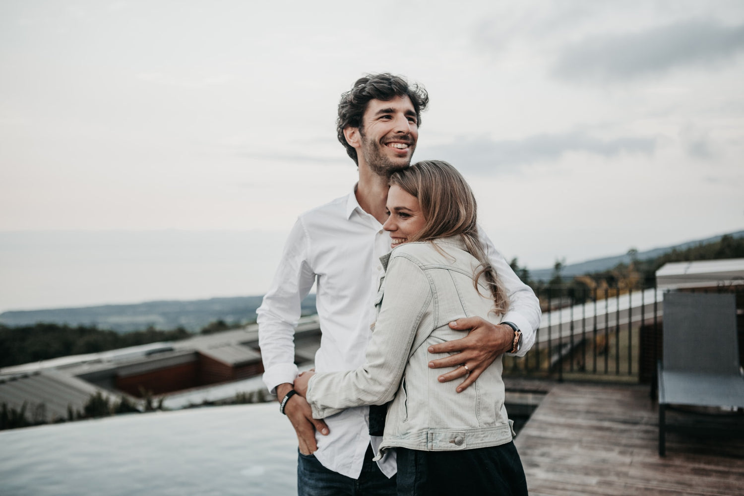 Tall Man Hugging Woman